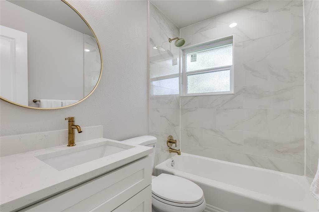 14234 Queens Chapel Road Farmers Branch, TX 75234 - Photo 18 of 21 a bathroom with a sink a toilet and shower