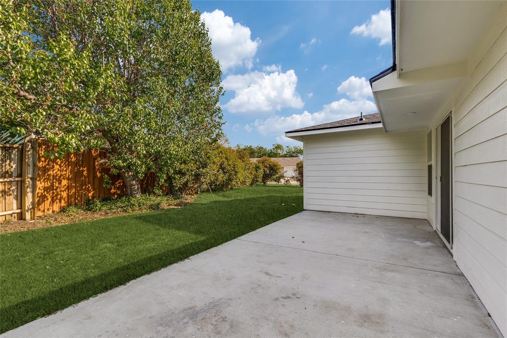 14234 Queens Chapel Road Farmers Branch, TX 75234 - Photo 19 of 21 a view of a house with a yard