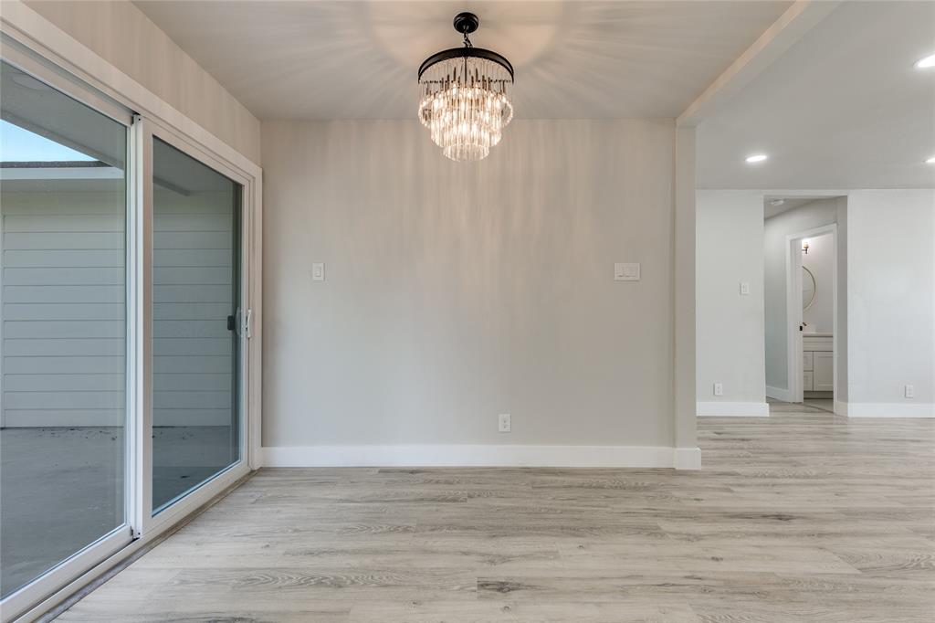 14234 Queens Chapel Road Farmers Branch, TX 75234 - Photo 9 of 21 a view of a livingroom with wooden floor