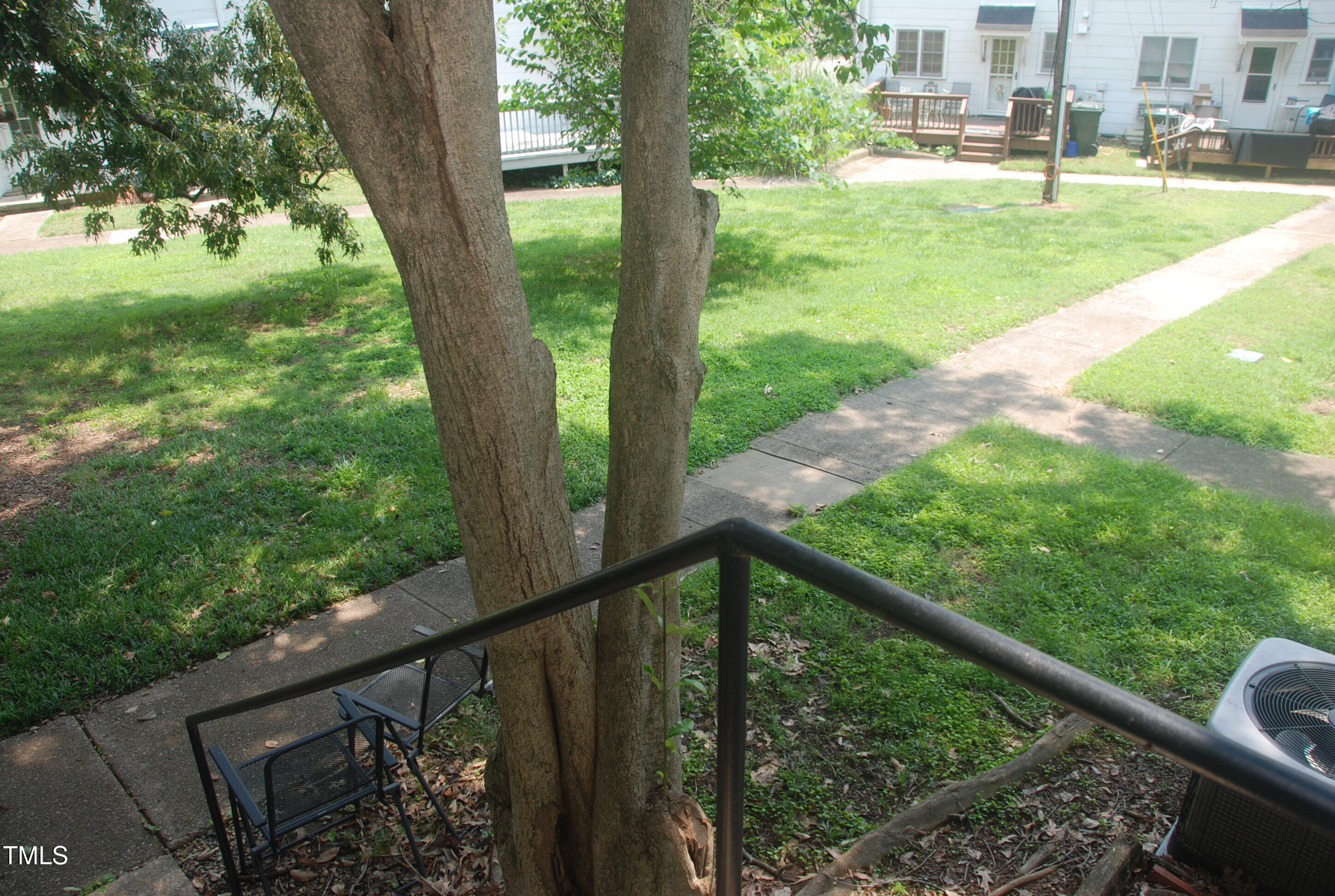 1908 Smallwood Drive Raleigh, NC 27605 - Photo 15 of 30 a view of a porch with a yard