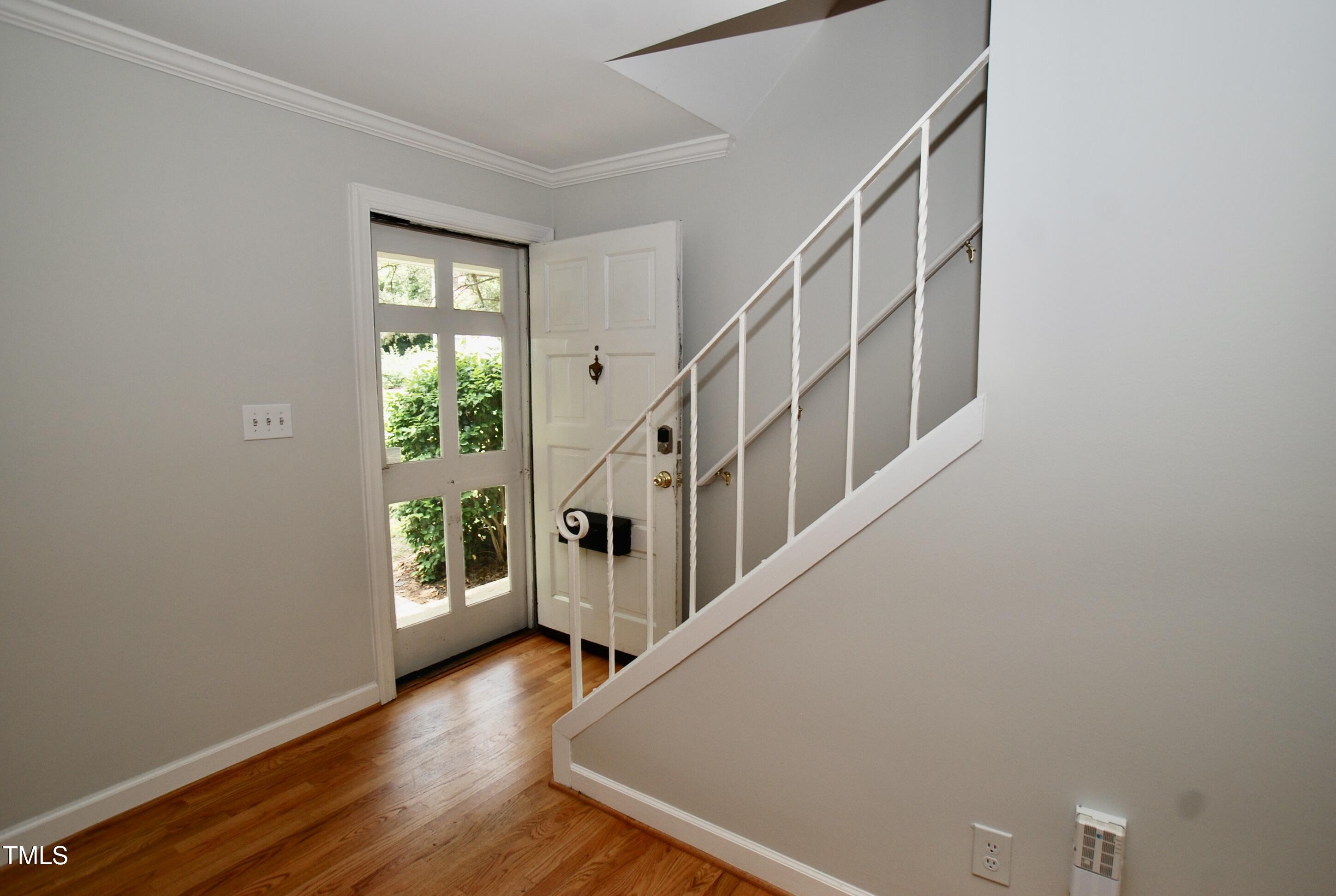 1908 Smallwood Drive Raleigh, NC 27605 - Photo 2 of 30 a view of an entryway with wooden floor