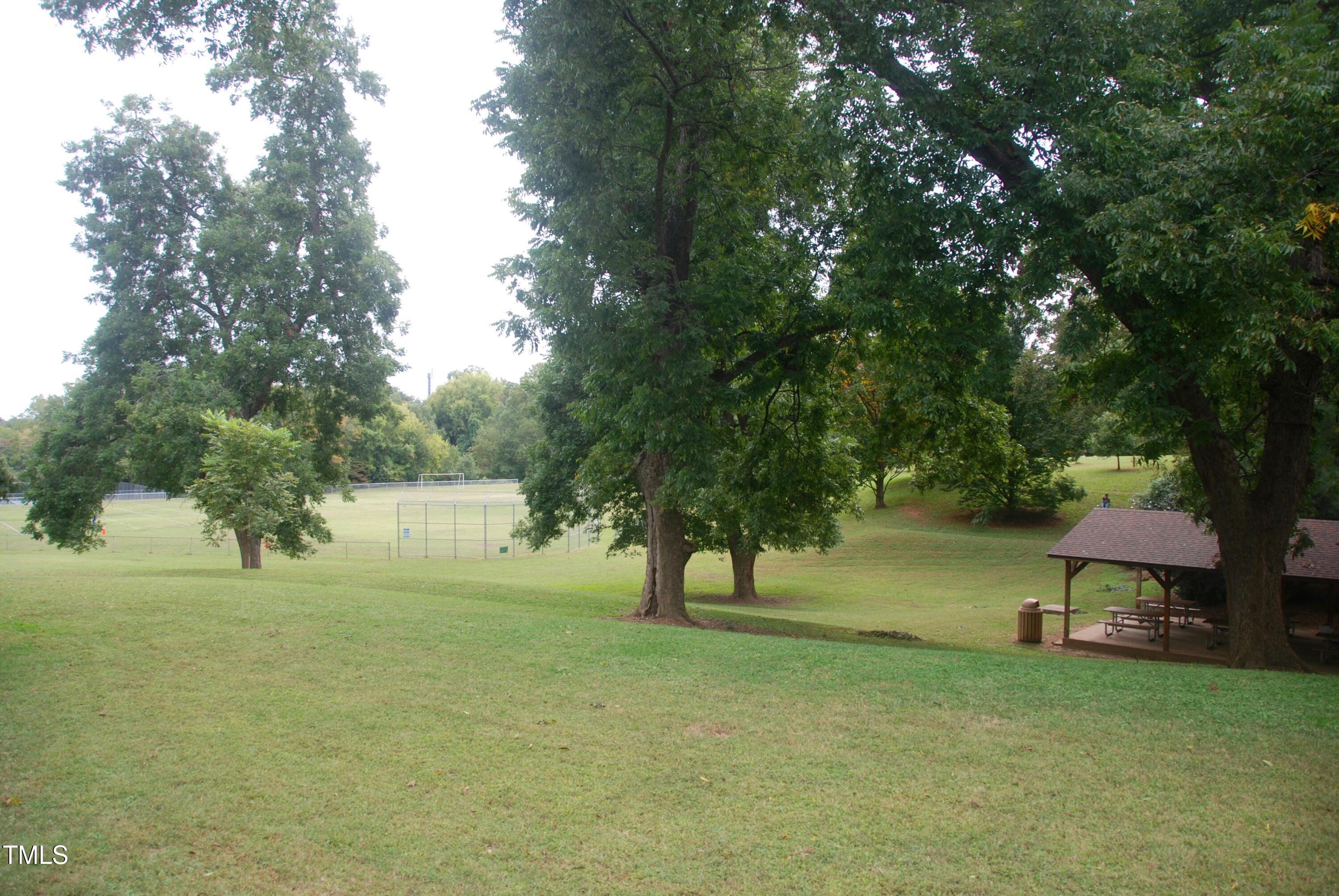 1908 Smallwood Drive Raleigh, NC 27605 - Photo 29 of 30 a view of a park with a tree