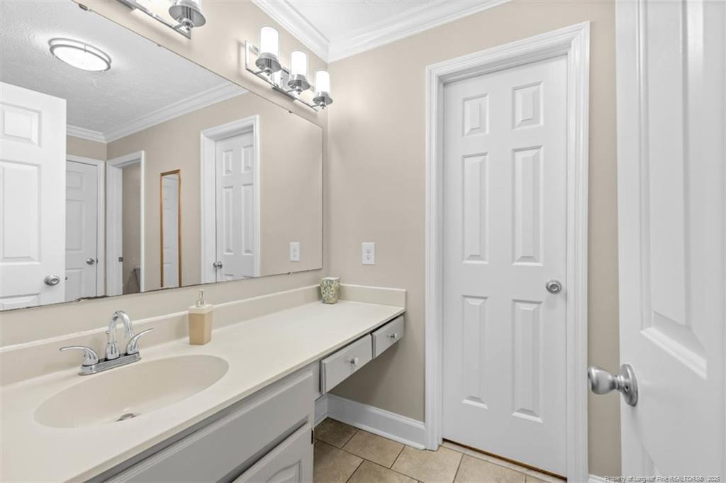6922 South Staff Road Fayetteville, NC 28306 - Photo 17 of 45 a bathroom with a sink double vanity and a mirror