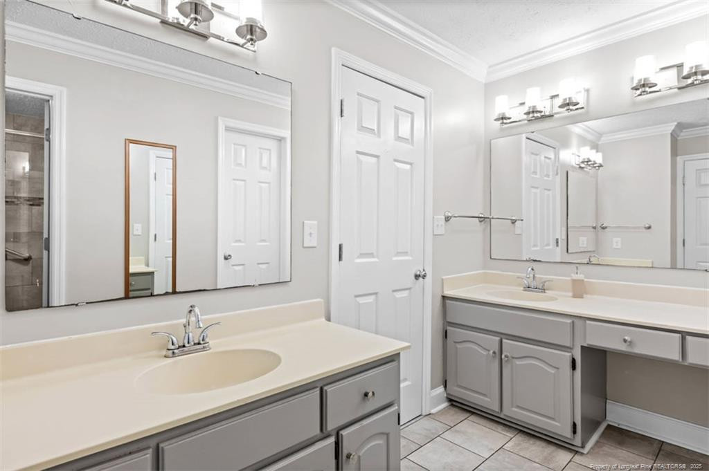 6922 South Staff Road Fayetteville, NC 28306 - Photo 18 of 45 a bathroom with a sink and a mirror