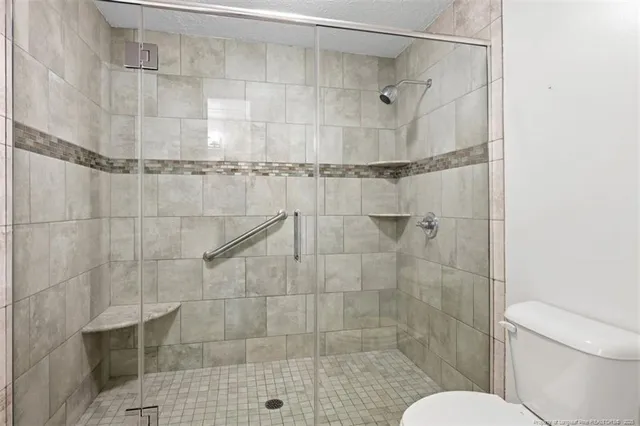 a bathroom with a shower and a toilet