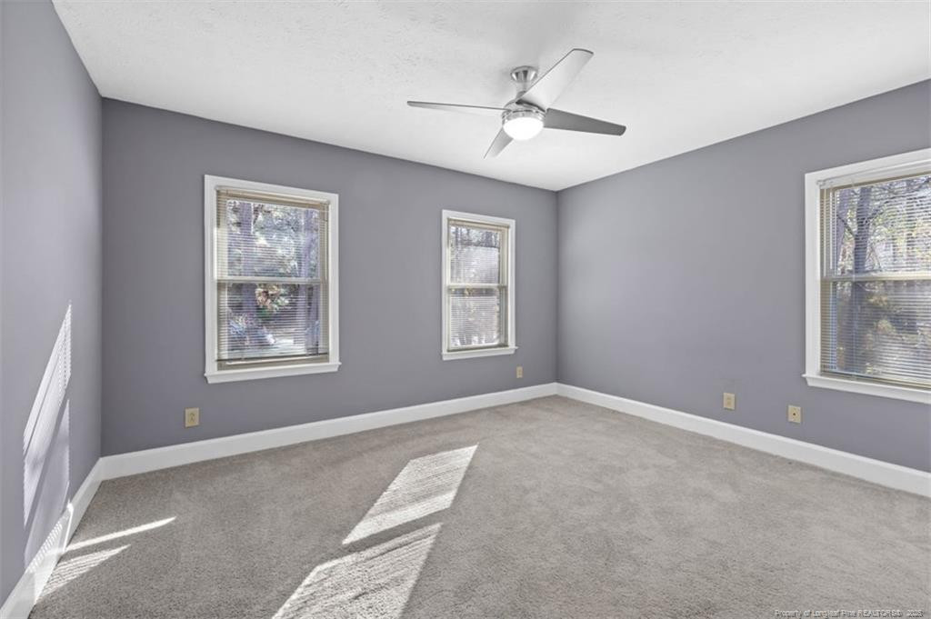 6922 South Staff Road Fayetteville, NC 28306 - Photo 23 of 45 a view of a livingroom with a ceiling fan and window