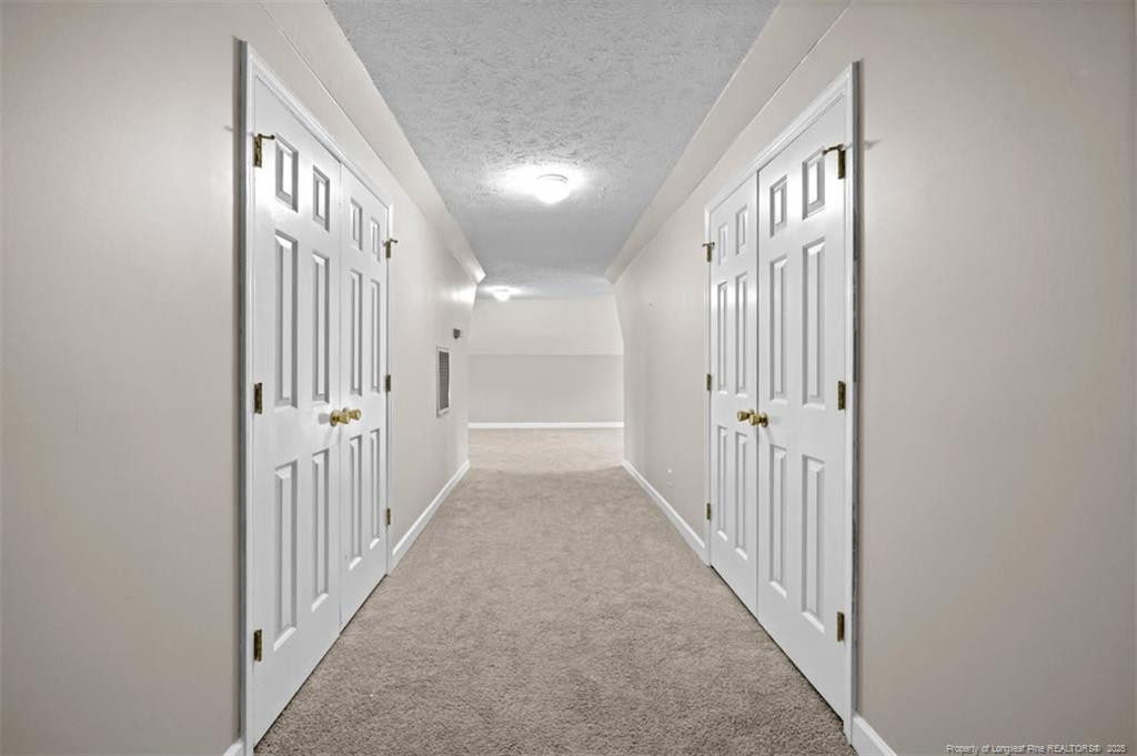6922 South Staff Road Fayetteville, NC 28306 - Photo 32 of 45 a view of a hallway with wooden floor