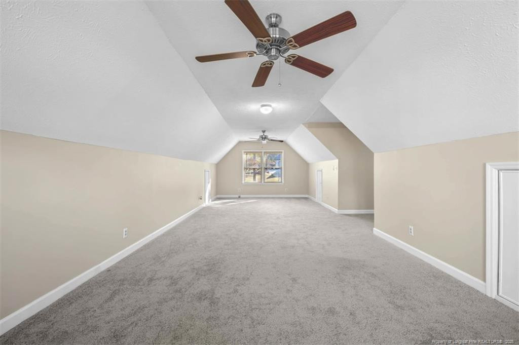 6922 South Staff Road Fayetteville, NC 28306 - Photo 34 of 45 an empty room with a ceiling fan and a window