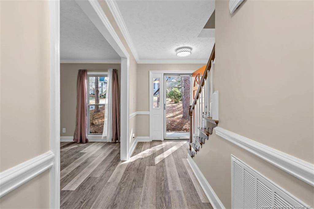 6922 South Staff Road Fayetteville, NC 28306 - Photo 5 of 45 a view of hallway with wooden floor