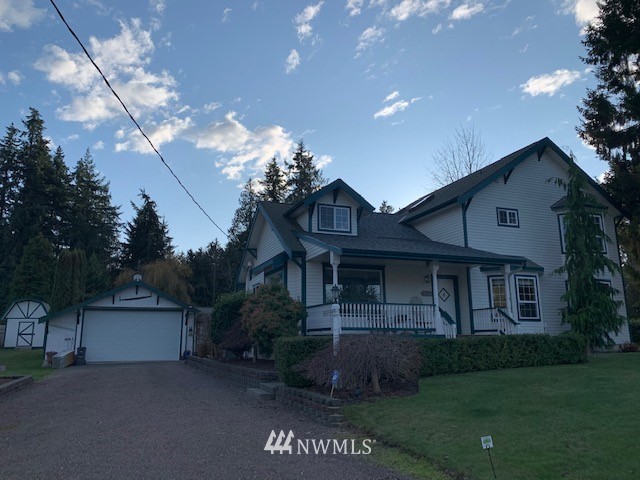 8106 Skipley Road Snohomish, WA 98290 - Photo 1 of 1 a front view of a house with garden