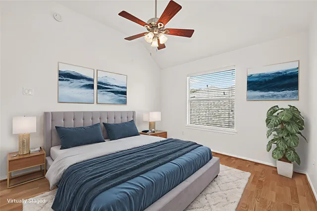 a bedroom with a bed dresser and a window