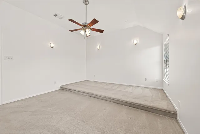 an empty room with fan