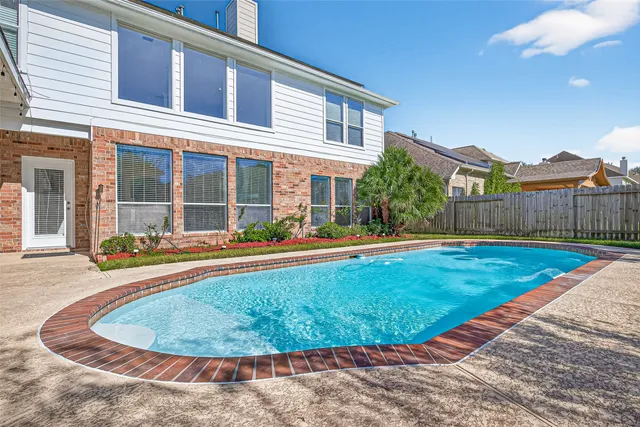 a view of a house with swimming pool