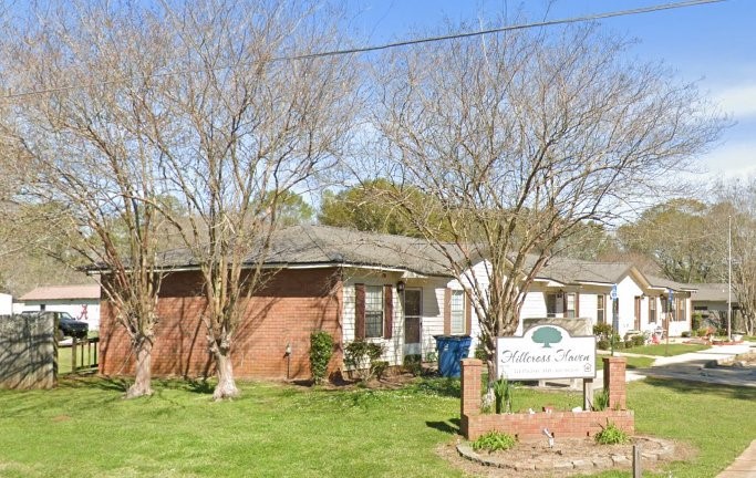 11 Hillcross Street Other, AL 36456 - Photo 5 of 6 a front view of a house with a yard table and chairs