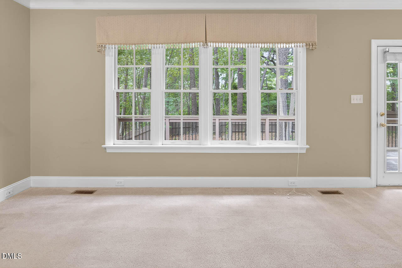 2209 Lodestar Drive Raleigh, NC 27615 - Photo 12 of 50 a view of an empty room with a window
