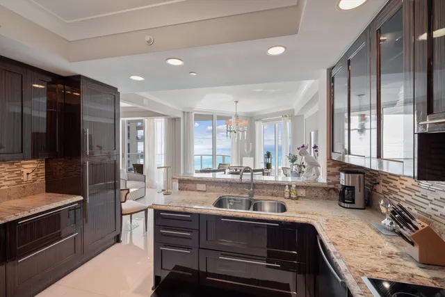a kitchen with sink stove and cabinets