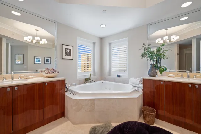 a bath tub sitting in a bathroom next to a window