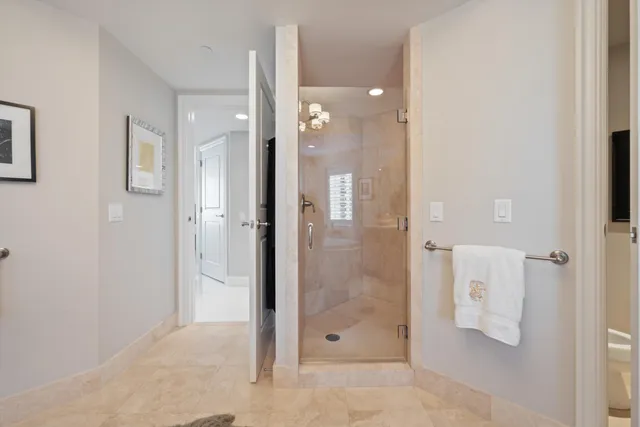 a bathroom with a shower and a sink