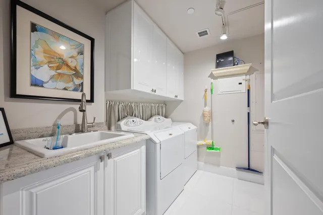 a view of a storage & utility room with a sink