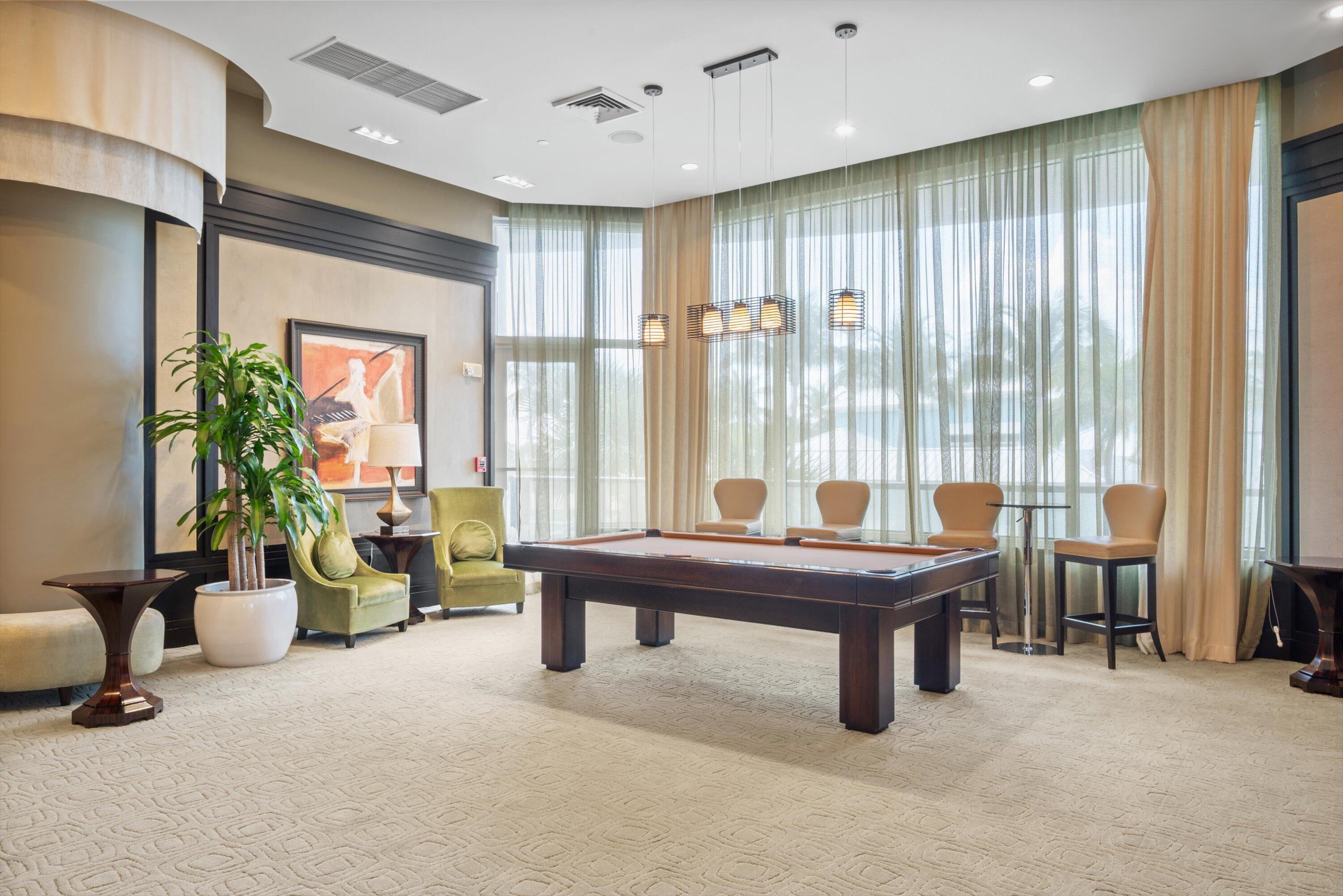 2700 North Ocean Drive, Unit 1401B Singer Island, FL 33404 - Photo 40 of 49 a room with furniture pool table and windows