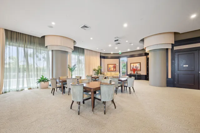 a view of a a dining room with furniture window and outside view