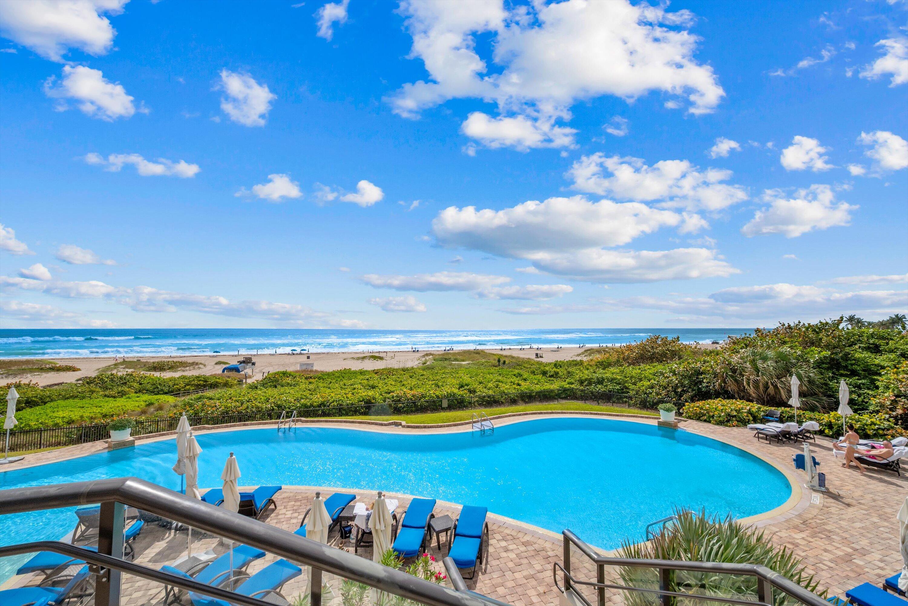 2700 North Ocean Drive, Unit 1401B Singer Island, FL 33404 - Photo 45 of 49 a view of a swimming pool with an outdoor seating a yard swimming pool and ocean view