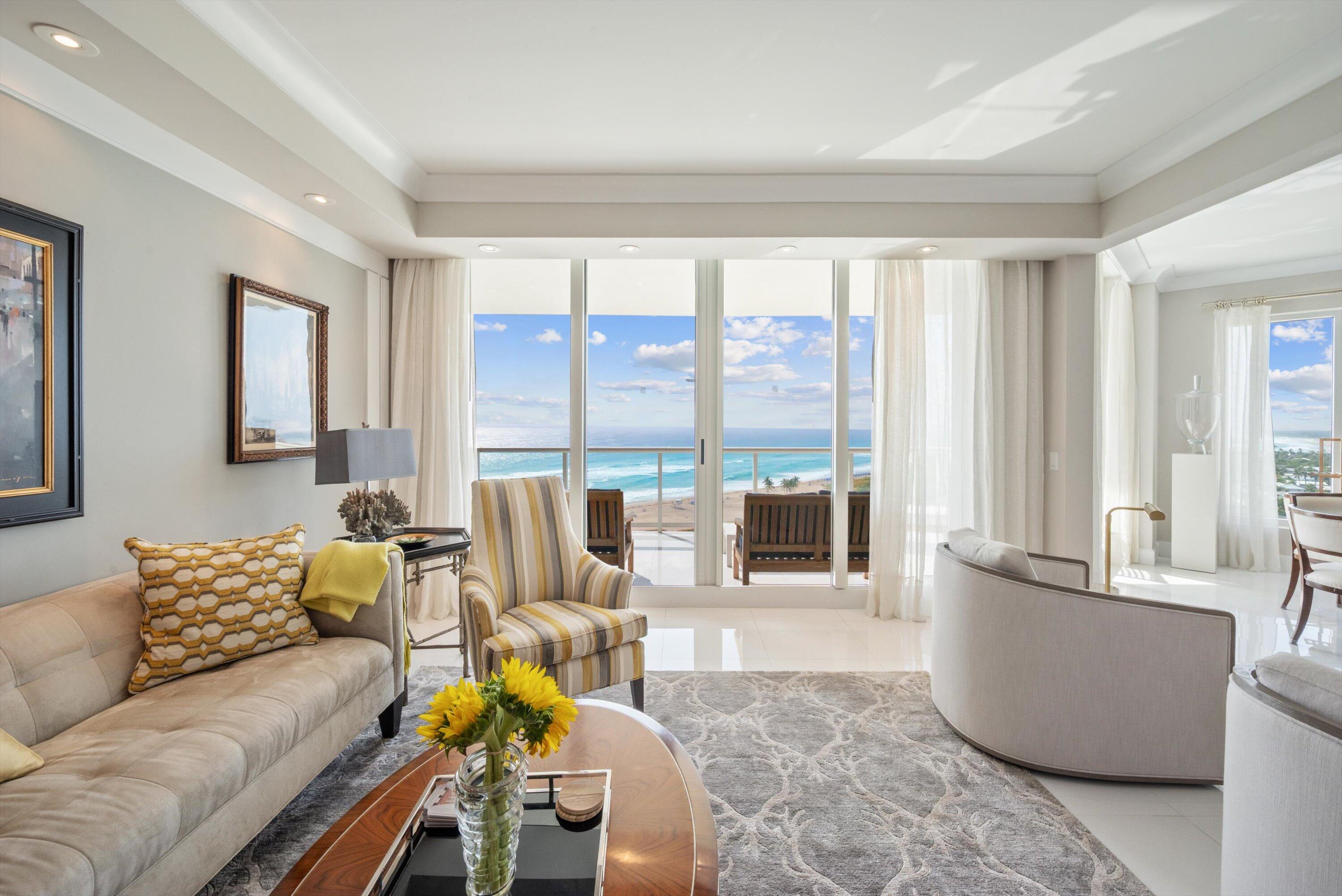 2700 North Ocean Drive, Unit 1401B Singer Island, FL 33404 - Photo 7 of 49 a living room with furniture and floor to ceiling windows