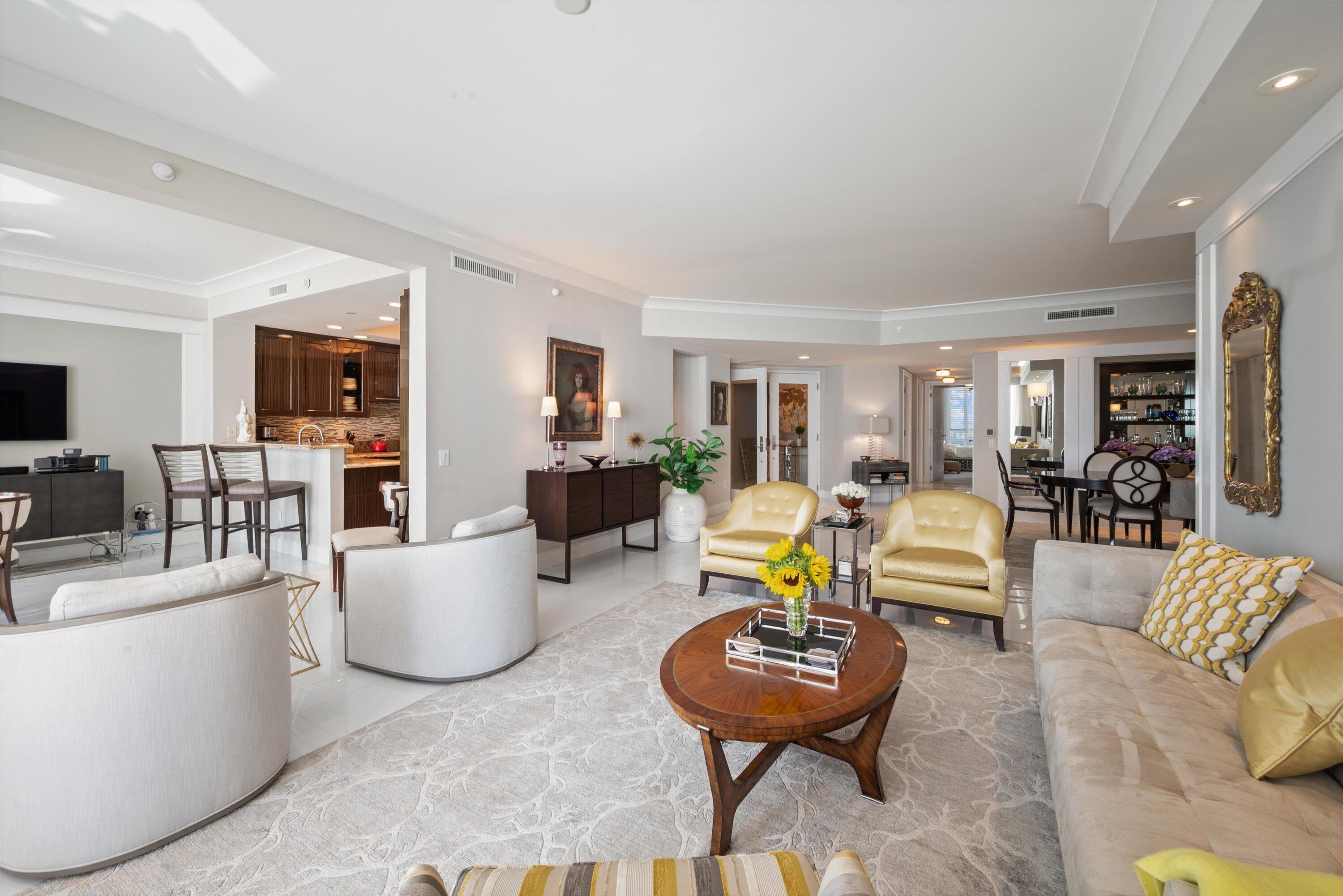 2700 North Ocean Drive, Unit 1401B Singer Island, FL 33404 - Photo 9 of 49 a living room with fireplace furniture and a flat screen tv