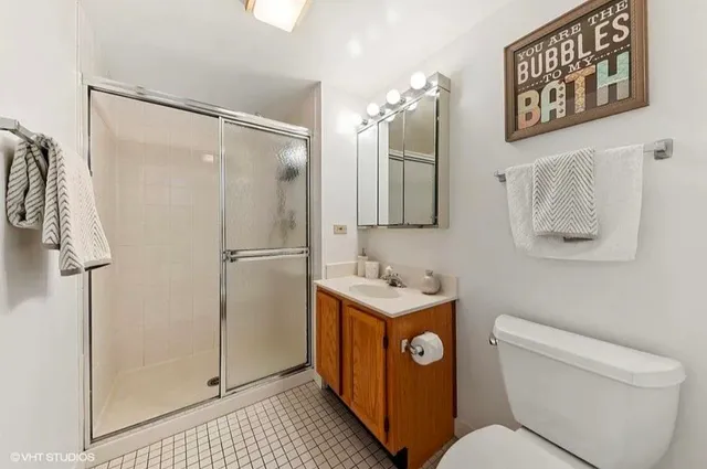 a bathroom with a toilet sink and shower