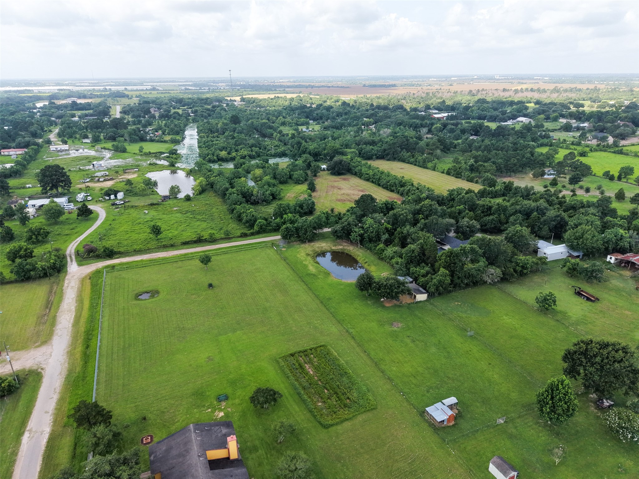 28619 Barry Lane Waller, TX 77484 - Photo 28 of 28 Bird's-eye view showcasing the property's open acreage, existing improvements, and peaceful country surroundings.