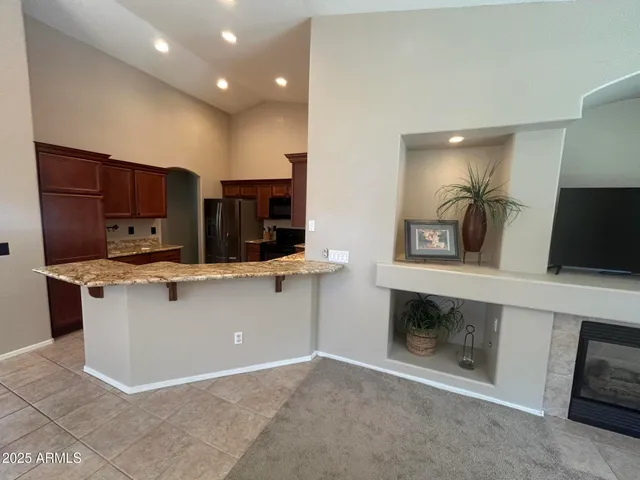 a kitchen with stainless steel appliances granite countertop a stove and a sink