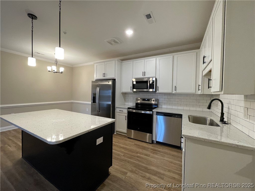 220 Gallery Drive, Unit 201 Spring Lake, NC 28390 - Photo 2 of 17 a kitchen with stainless steel appliances granite countertop a sink a stove a refrigerator a center island and cabinets
