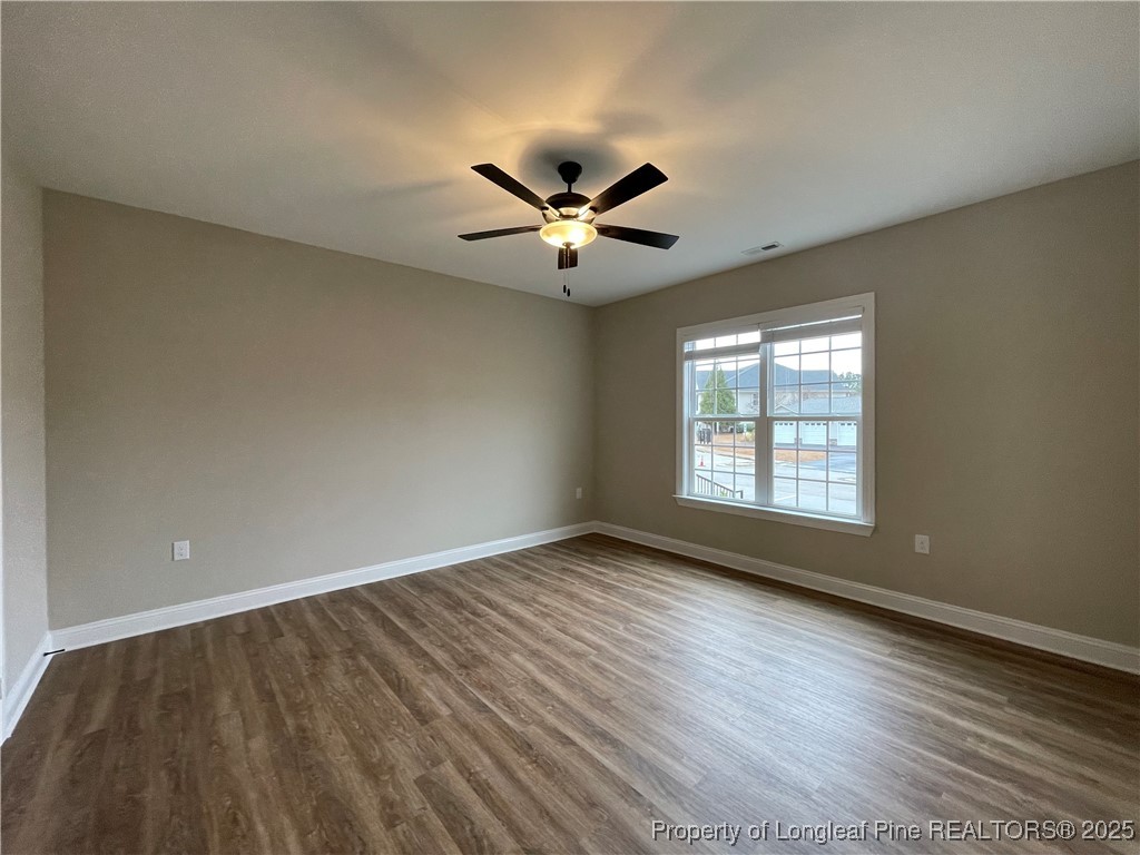 220 Gallery Drive, Unit 201 Spring Lake, NC 28390 - Photo 9 of 17 wooden floor in an empty room with a window