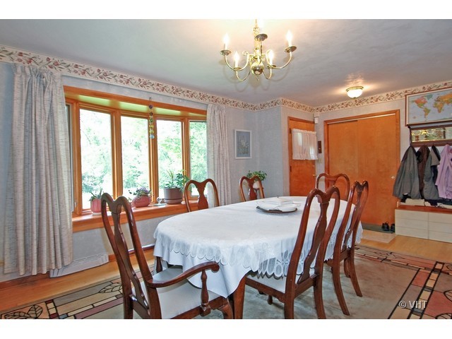 11N918 Almora Terrace Elgin, IL 60124 - Photo 5 of 10 a view of a dining room with furniture window and outside view