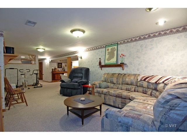 11N918 Almora Terrace Elgin, IL 60124 - Photo 6 of 10 a living room with furniture and a flat screen tv