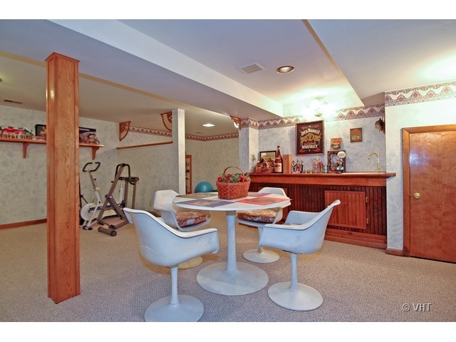 11N918 Almora Terrace Elgin, IL 60124 - Photo 9 of 10 a dining room with furniture and wooden floor
