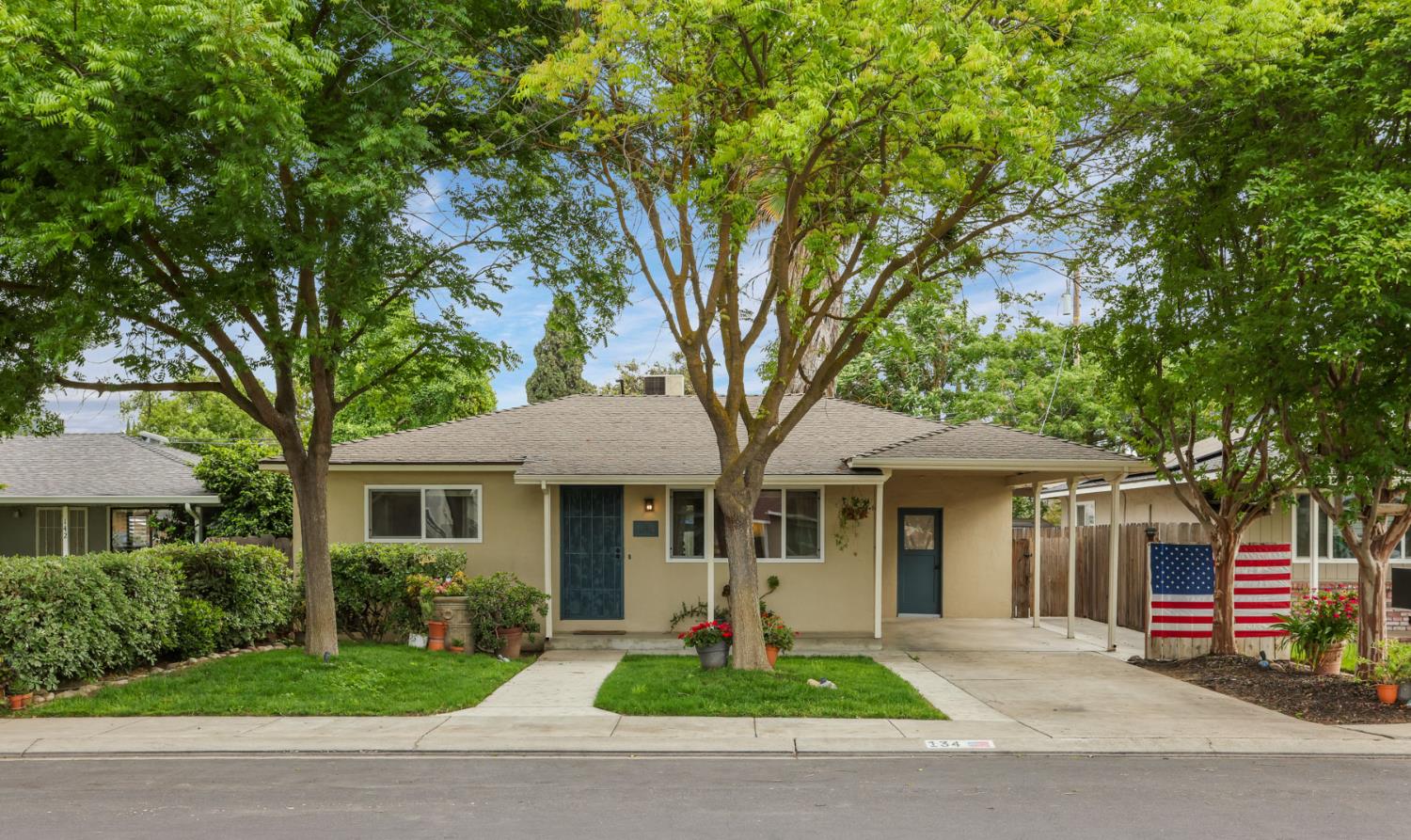 134 East Washington Street Ripon, CA 95366 - Photo 1 of 1 a front view of a house with a garden