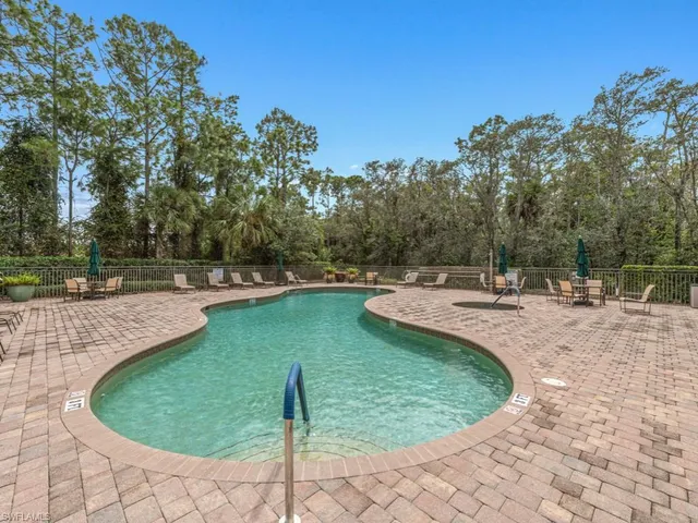 a view of a swimming pool with a sitting area