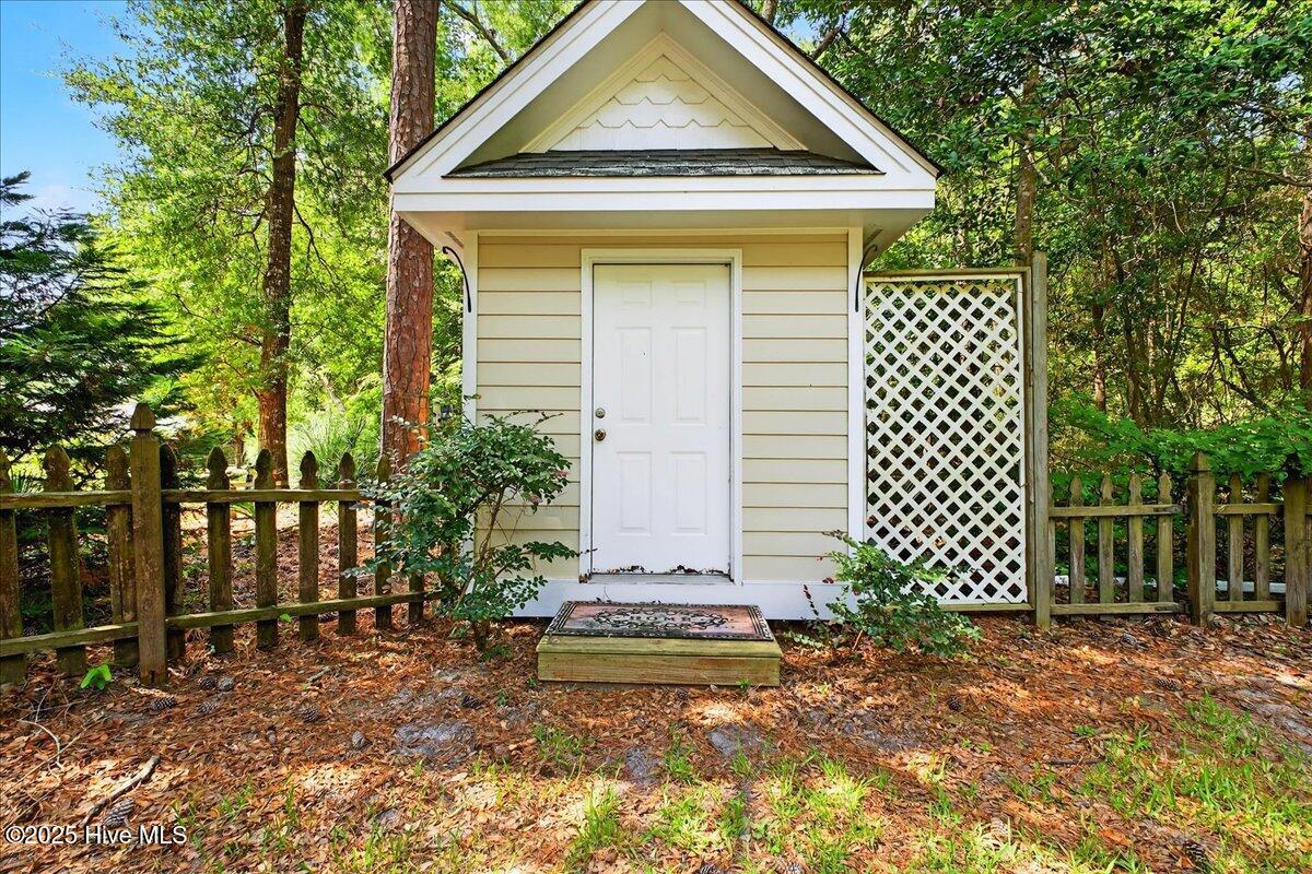 8985 Woodbine Road Southwest Sunset Beach, NC 28468 - Photo 52 of 65 Shed in backyard