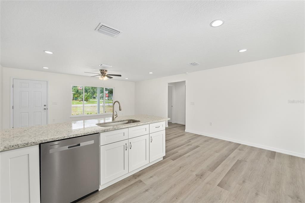 13019 Northeast 7th Loop Silver Springs, FL 34488 - Photo 23 of 35 a kitchen with a sink cabinets and window
