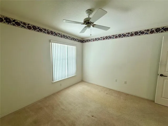 a view of a room that has a window in it
