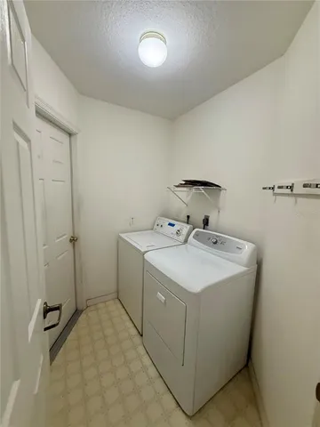 a porch with a bench in front of it