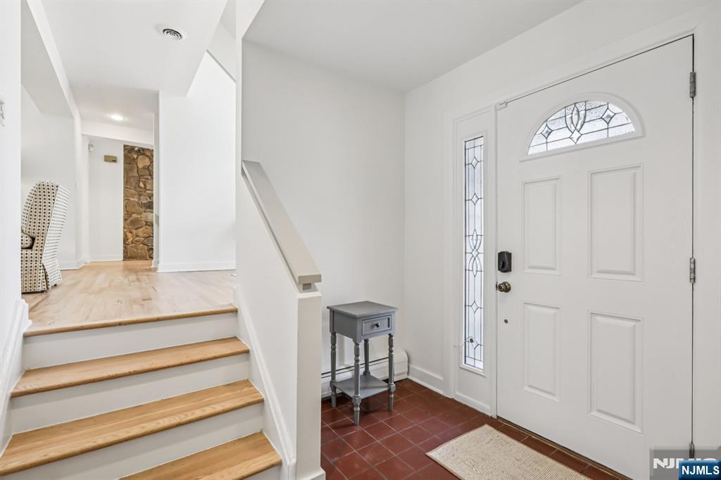11 Carlough Road Upper Saddle River, NJ 07458 - Photo 24 of 41 a view of entryway with wooden floor and stairs