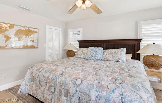 265 Yorkshire Court, Unit 8 Naples, FL 34112 - Photo 17 of 33 Bedroom featuring a ceiling fan and a closet