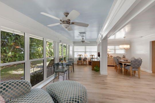 265 Yorkshire Court, Unit 8 Naples, FL 34112 - Photo 18 of 33 Sunroom featuring wood finished floors and baseboards