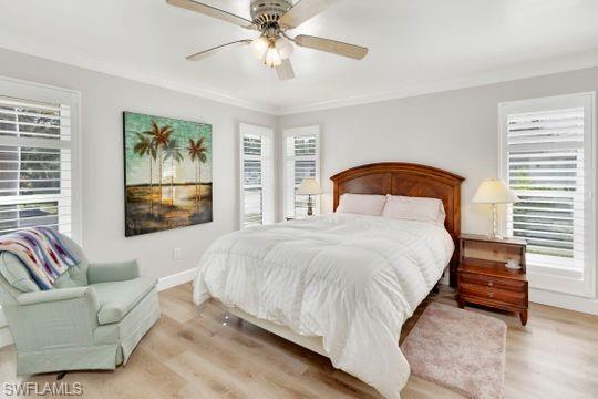 265 Yorkshire Court, Unit 8 Naples, FL 34112 - Photo 7 of 33 Bedroom with light wood-style flooring and ceiling fan