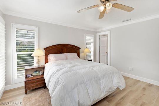 265 Yorkshire Court, Unit 8 Naples, FL 34112 - Photo 8 of 33 Bedroom featuring crown molding, light wood-type flooring, and a ceiling fan