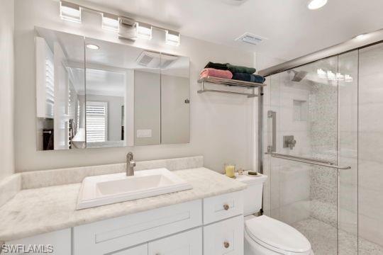 265 Yorkshire Court, Unit 8 Naples, FL 34112 - Photo 9 of 33 Bathroom featuring vanity, a stall shower, and recessed lighting