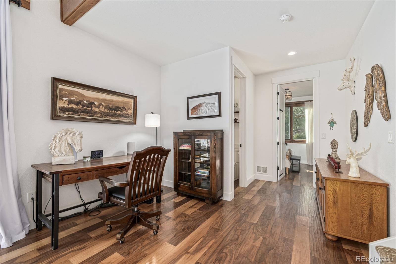 663 Brookside Drive Bailey, CO 80421 - Photo 23 of 47 a view of a workspace with furniture and wooden floor