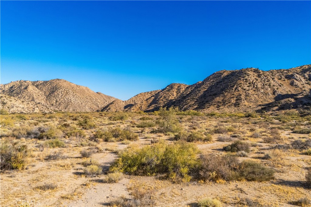 6350 Pioneertown Road Pioneertown, CA 92268 - Photo 17 of 36 a view of a large mountain with a mountain in the background